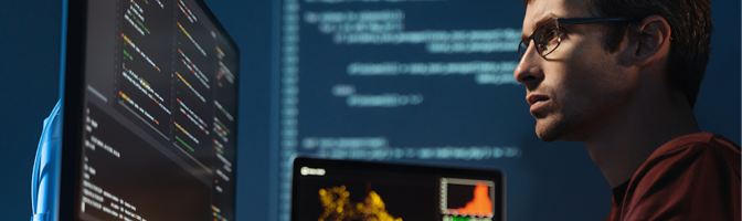 Programmer man looking at big monitor checking id-address and debugging system, writing html code