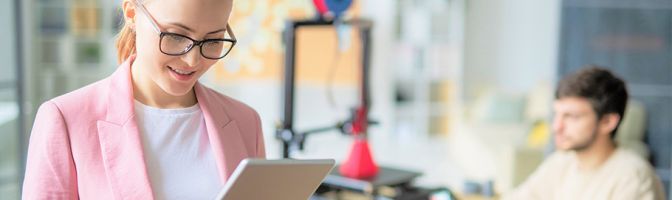 woman looking at tablet