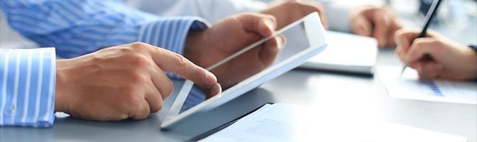 Man using tablet during meeting