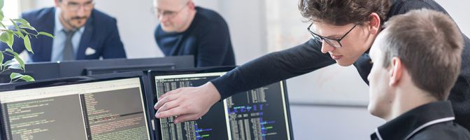 woman pointing out something on a computer screen