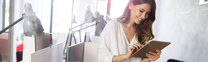 Entrepreneur looking at a document on a tablet device.