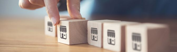 close up of someone arranging wooden blocks