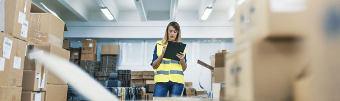 woman taking inventory in a warehouse