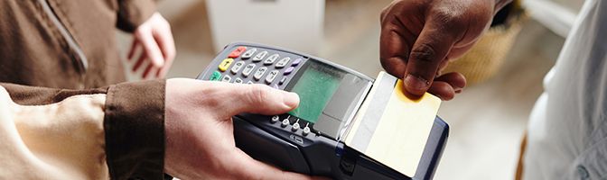 A customer uses a credit card to pay for a purchase.