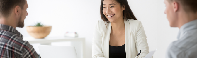 Female HR manager discussing employment benefits with two male employees