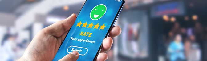 A close up of a smartphone screen showing a customer providing a satisfaction rating.