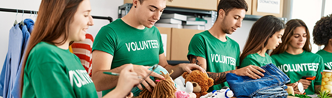 Employees of a business volunteer at a shelter.