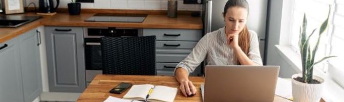 Woman conducting research on laptop