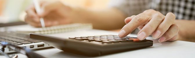 close up of someone using a calculator