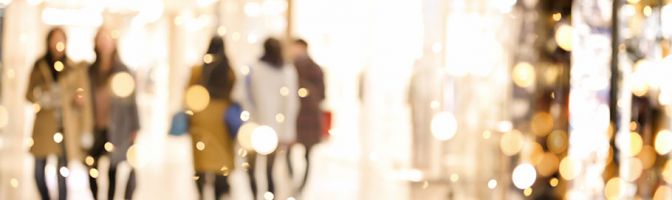 people walking through a mall