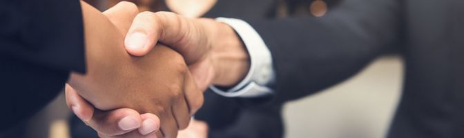 closeup of two people shaking hands