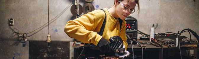 female metal worker in workshop