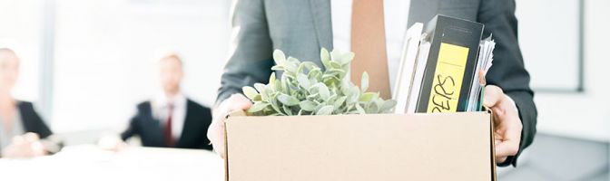 closeup of a man carrying a box