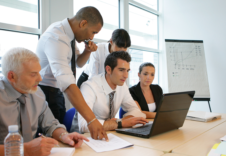 Business people in a meeting with a laptop computer