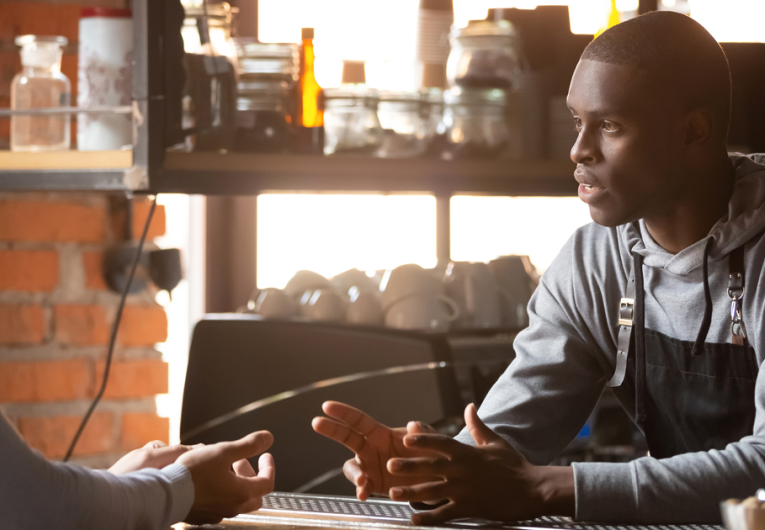 Restaurant worker owner interviewing new hire candidate for seasonal opening