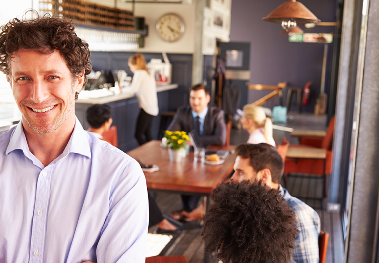 Male restaurant owner, portrait with arms crossed