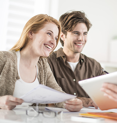 a couple having a discussion with financial planner