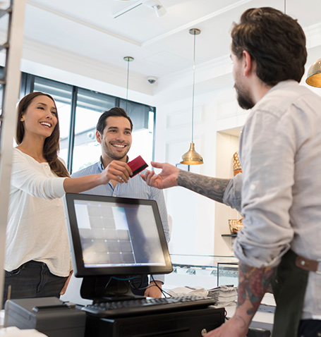 woman handing someone her credit card