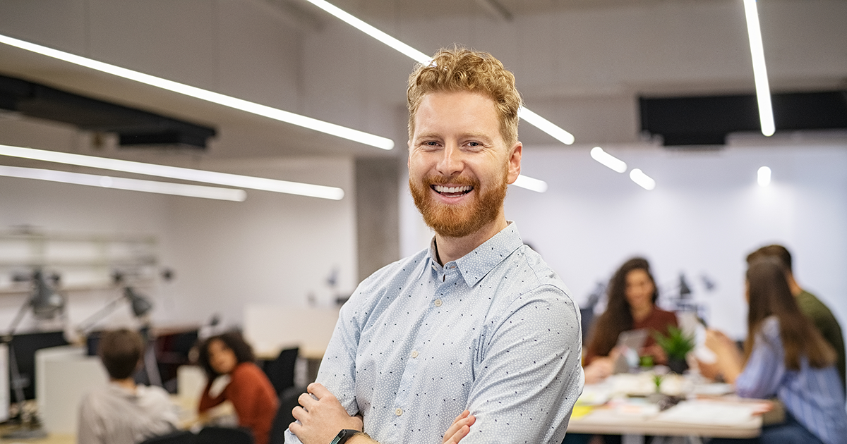   Save Download Preview Happy successful businessman standing in office.