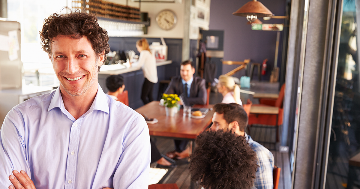 Male restaurant owner, portrait with arms crossed