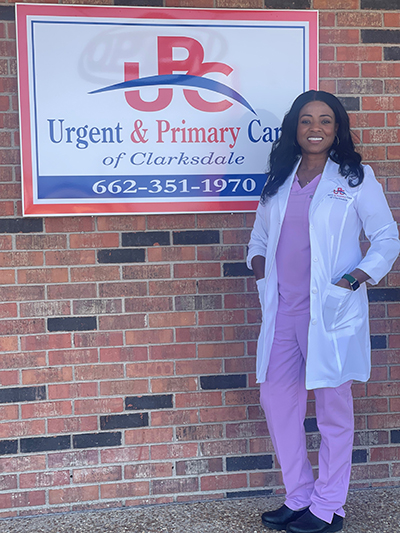 Dr. Mary Williams, CEO and owner of Urgent & Primary Care Clinic of Clarksdale, stands in front of her business.